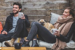 a couple drinking coffee on the floor