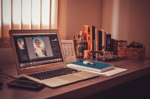 Creating an in-home working space with lap top and books on table