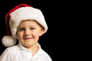 A kid with a Santa hat Christmas in Florida