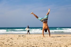 A man on the sand that knows how to enjoy Palm Bay FL.