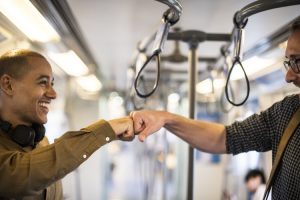 Two men fist-bumping.