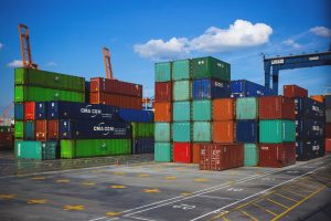 A large number of containers piled on top of each other the same way it happens during moving container rental