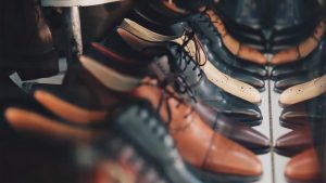 Dress shoes on a shelf.