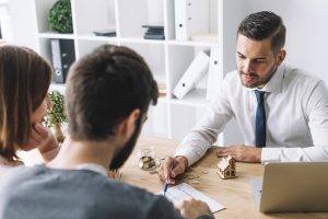 People in an office having a meeting- post-move paperwork