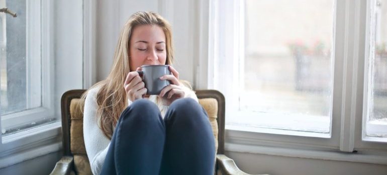 woman sitting and enjoying a coffee