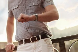 A man looking at his watch