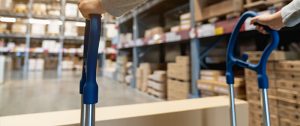 storage Florida - man strolling a box in a storage facility