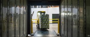 a forklift with boxes in a storage unit