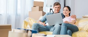 a couple looking at laptop