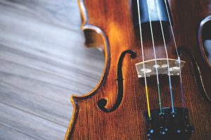 Violin on white surface.