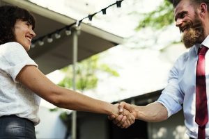 two persons handshaking