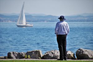 A man looking at a lake after moving to Pompano Beach FL. 