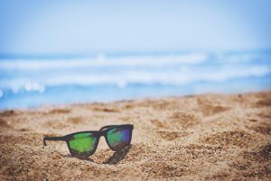 living in lake worth FL- sunglasses in the sand 