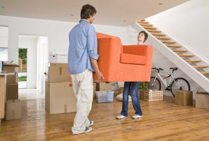 Couple moving furniture