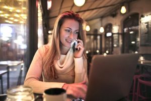 A woman who found her favourite spot within the Lake Worth neighborhoods being cozy while talking on the phone.