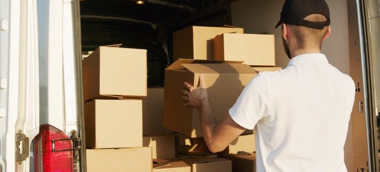 A mover loading a moving truck