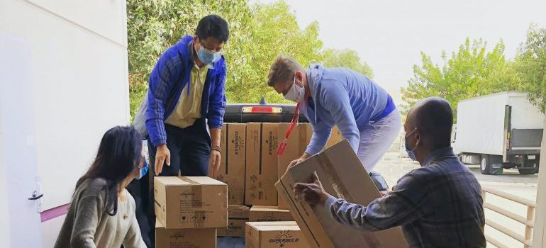 A moving team packing supplies.