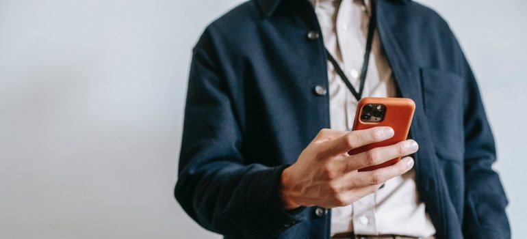 A man looking at his cell phone.