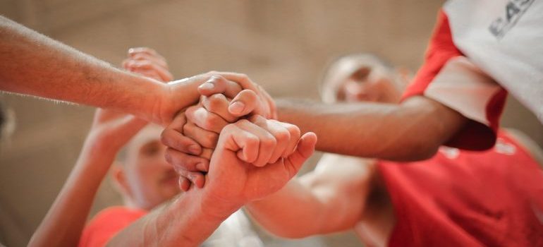 A team stacking hands.