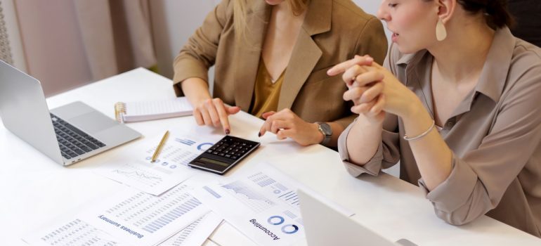 two local movers Coral Gables employees calculating 