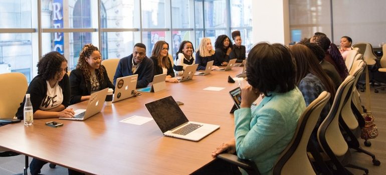 office room, meeting, people sitting at the table