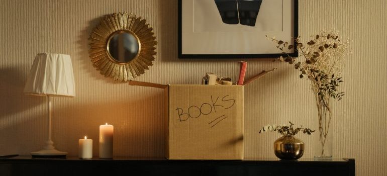 a box labeled books on a shelf