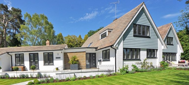 a nice white house with a yard