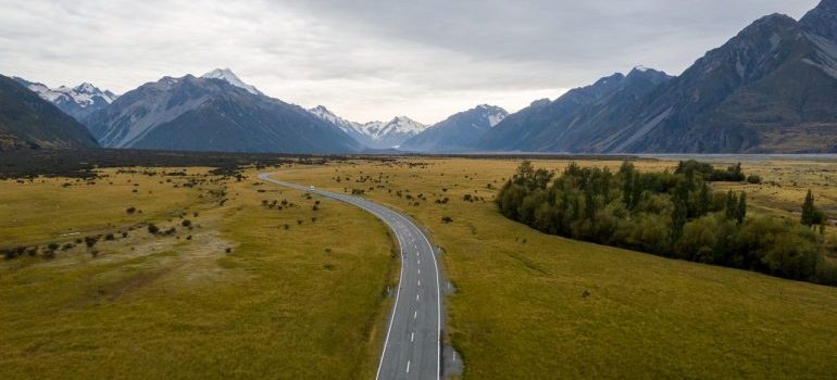 A road with mountains in the background.