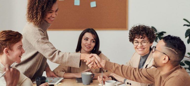 people in the office, making a deal, handshake