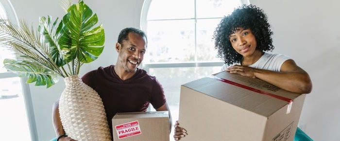 Couple with moving boxes.