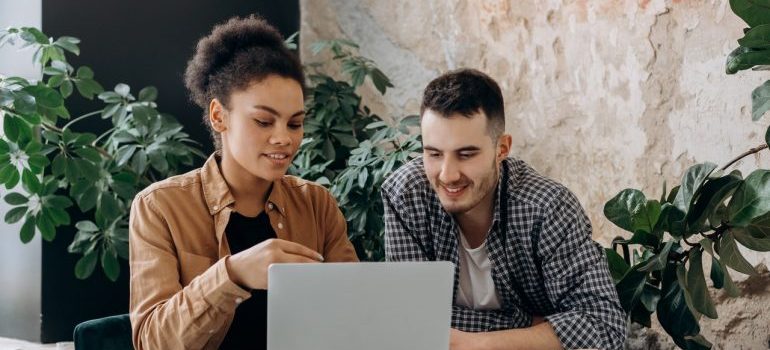 A young couple looking at laptop.