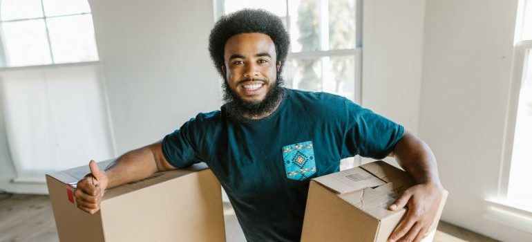 man holding a cardboard box