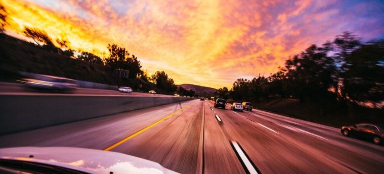 A speeding car on a highway.