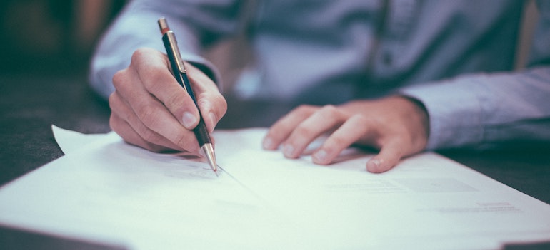 a man signing a contract