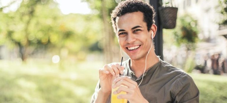 happy man drinking a lemonade