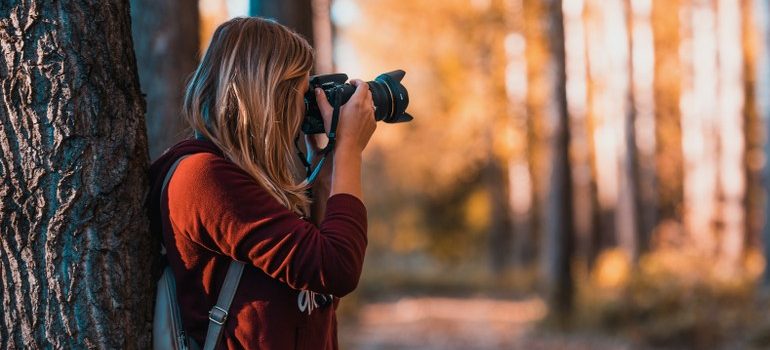 woman using a camera to take a picture