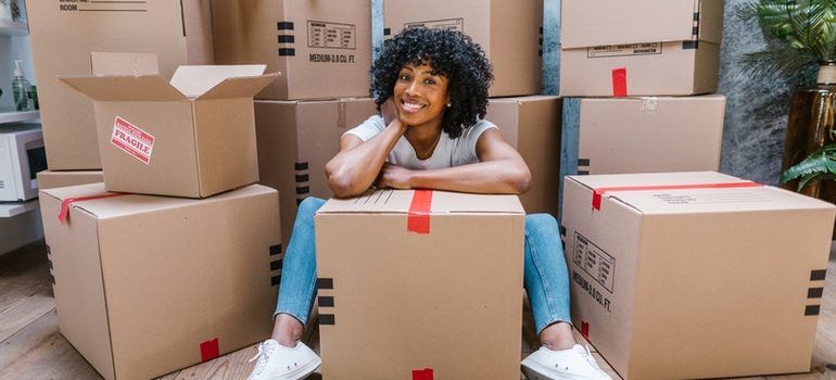 woman surrounded with boxes