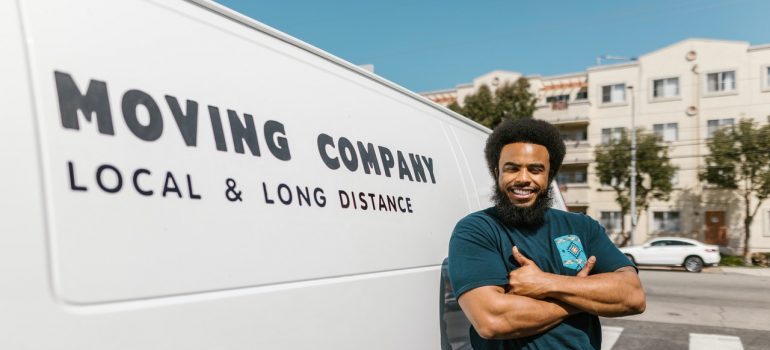 commercial mover in Naples standing next to a van