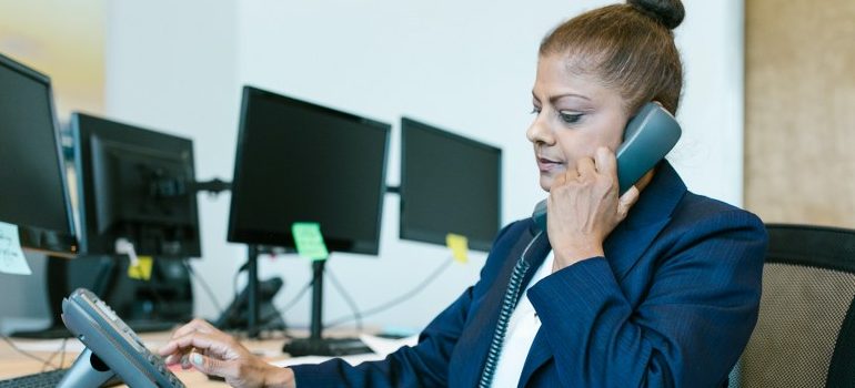 woman dialing a phone number