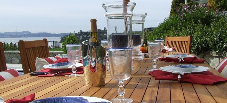 Restaurant table with plates, and glasses.