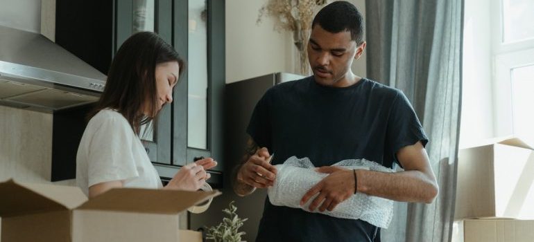 Couple packing for the move.