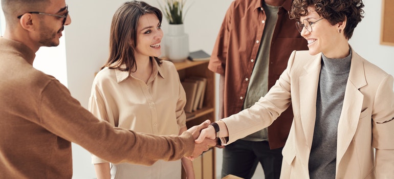 Woman smiling when making a deal with Davie long-distance movers