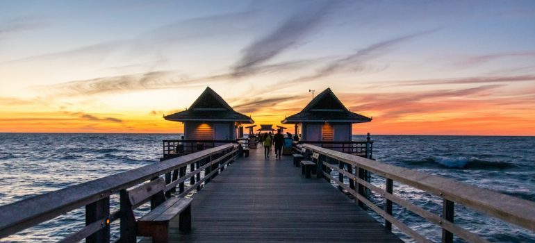 Pier with the sunset in the background.