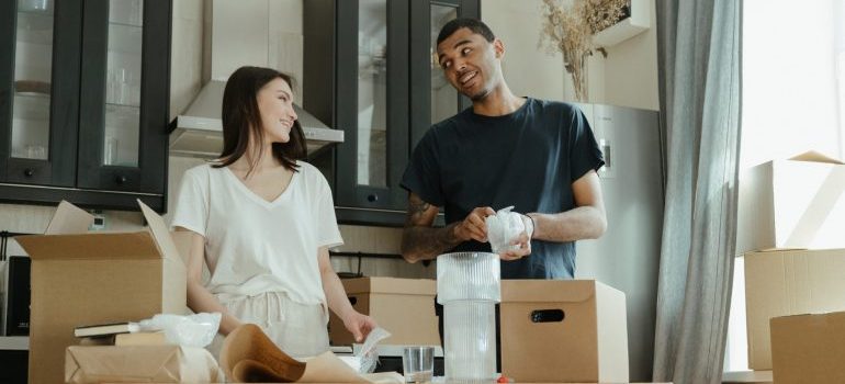 two people packing for a local move