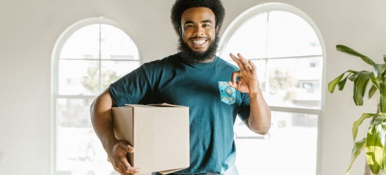 Bonita Springs mover holding a box