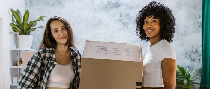 Two girls in the middle of a relocation.