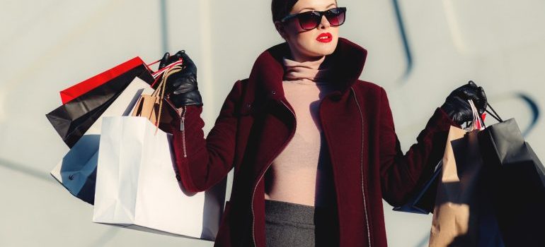 a woman with lots of bags from shopping