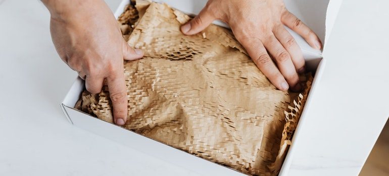 a box with brown paper