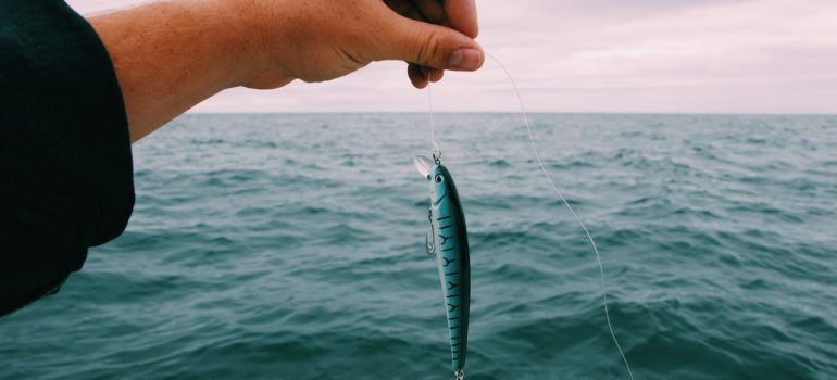 a man preparing his bait for fishing