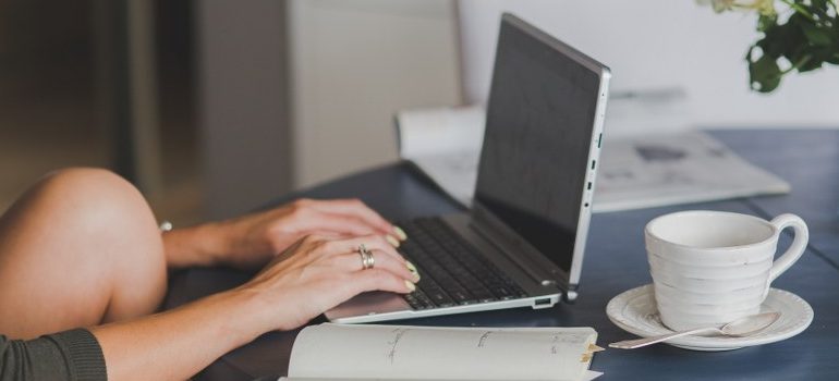 person typing with a laptop keyboard